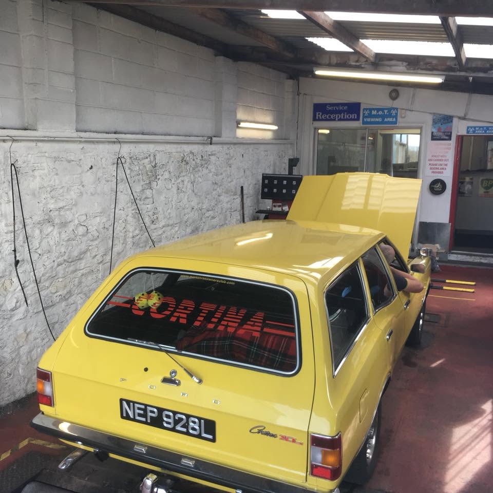 Yellow Cortina estate in for a service