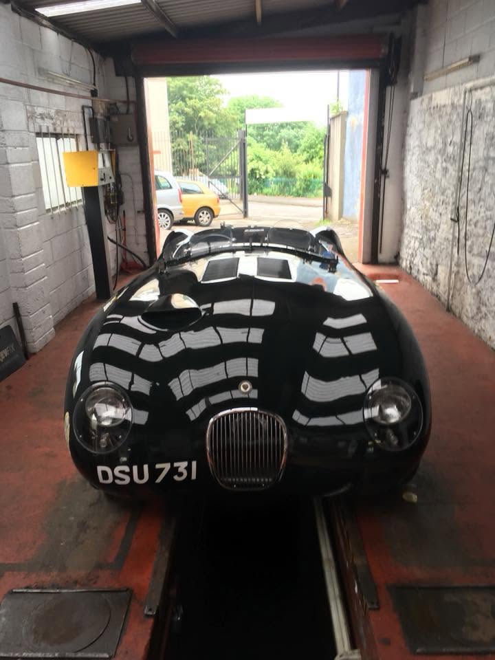 A cherished classic black sports car on the ramp