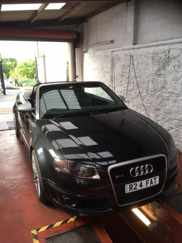 Modern black Audi convertible in the garage
