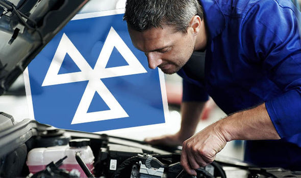 A professional mechanic inspecting under a car securely on a hydraulic lift during a comprehensive MOT inspection