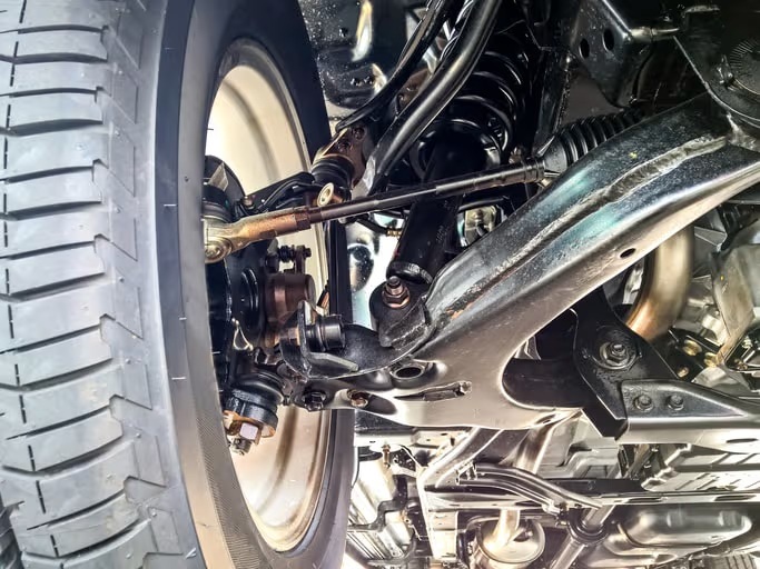 Laser wheel alignment equipment and heavy-duty suspension strut setup in the garage